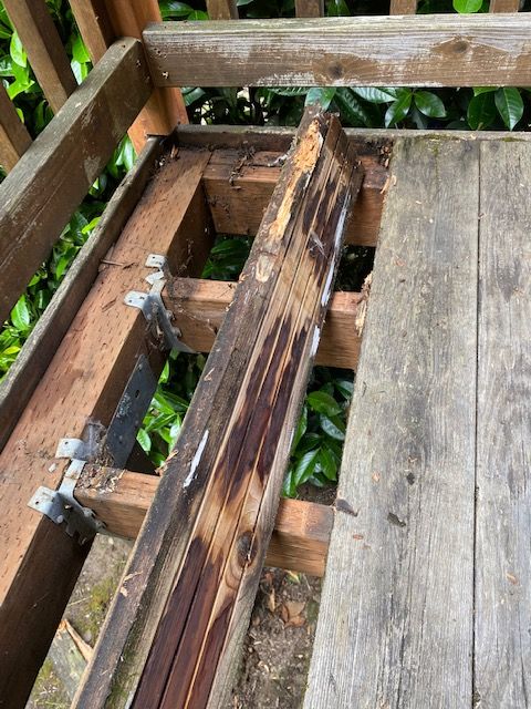 damaged deck in need of repair that has rotted