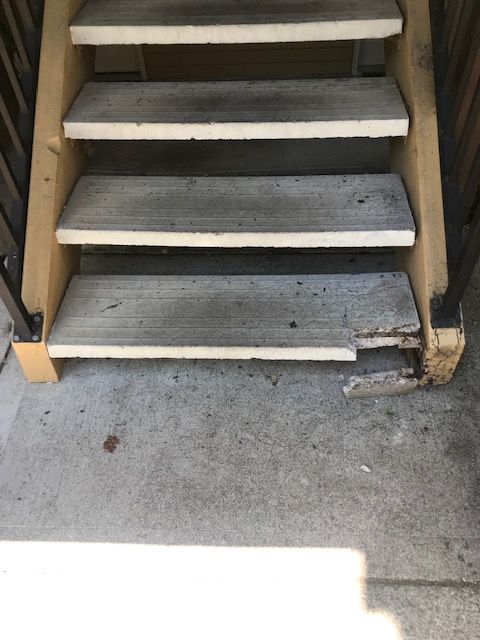 damaged step on a staircase at an apartment